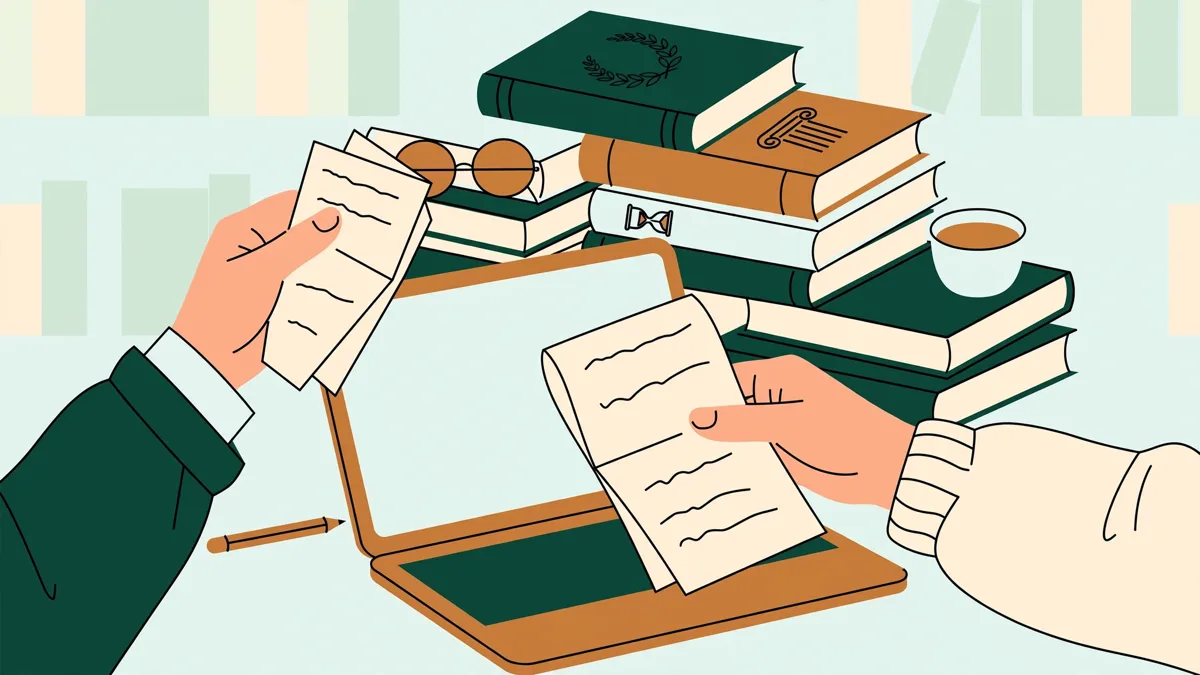 Deux étudiantes en bibliothèque qui comparent leurs notes devant une pile de livres et un ordinateur